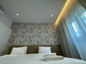 Close-up of a comfortable double bed in the Central Charming Apartment with Balcony Sea View, Ayia Napa, Cyprus.