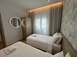 Comfortable twin bedroom with two single beds in the Charming Central Apartment with Sea View Balcony, Ayia Napa, Cyprus.