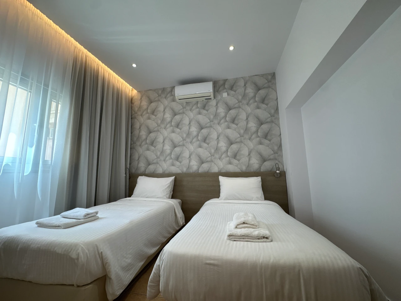 Comfortable twin bedroom with two single beds in the Central Charming Apartment with Balcony Sea View, Ayia Napa, Cyprus.